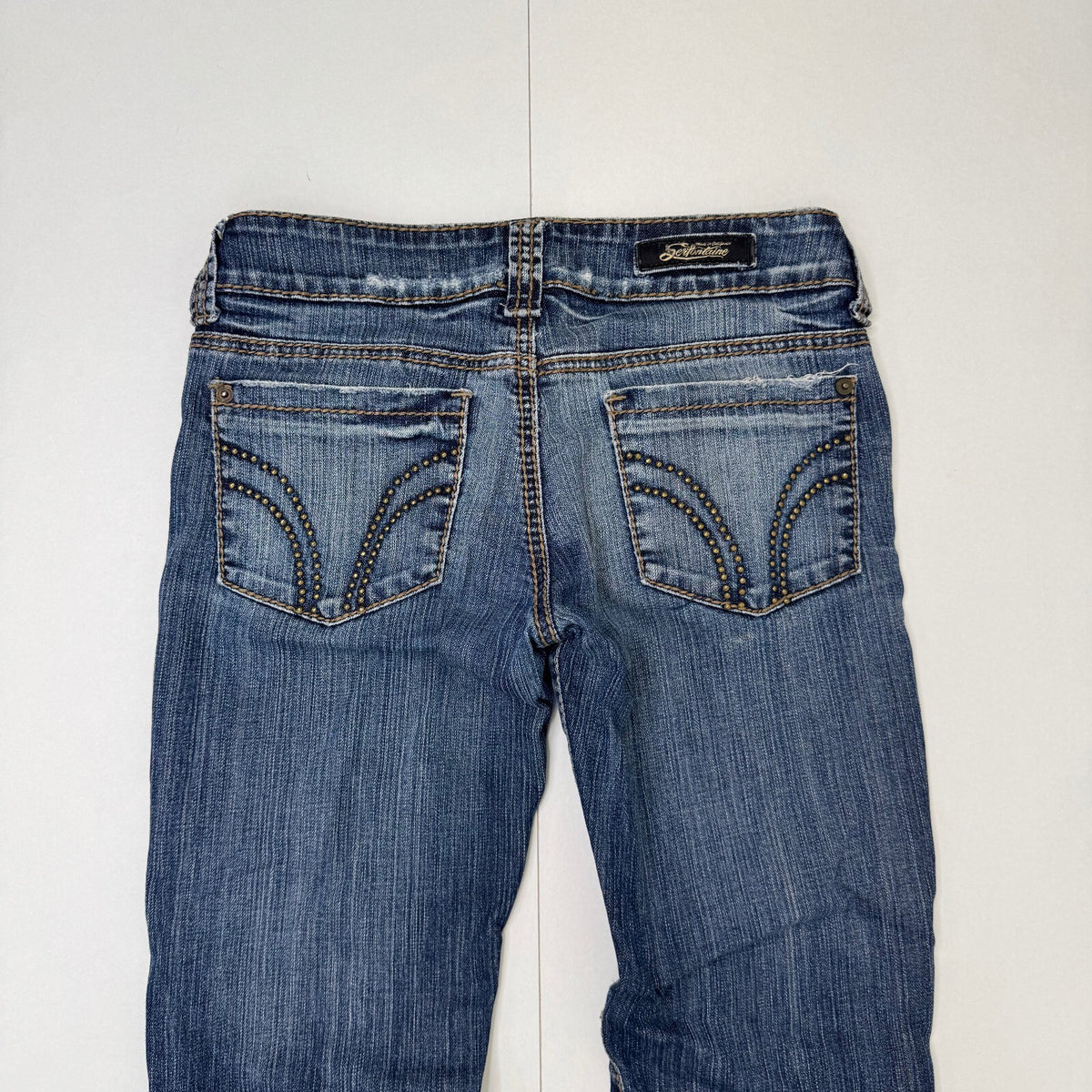 Y2K vintage low rise bootcut denim jeans mid blue faded wash studded distressed