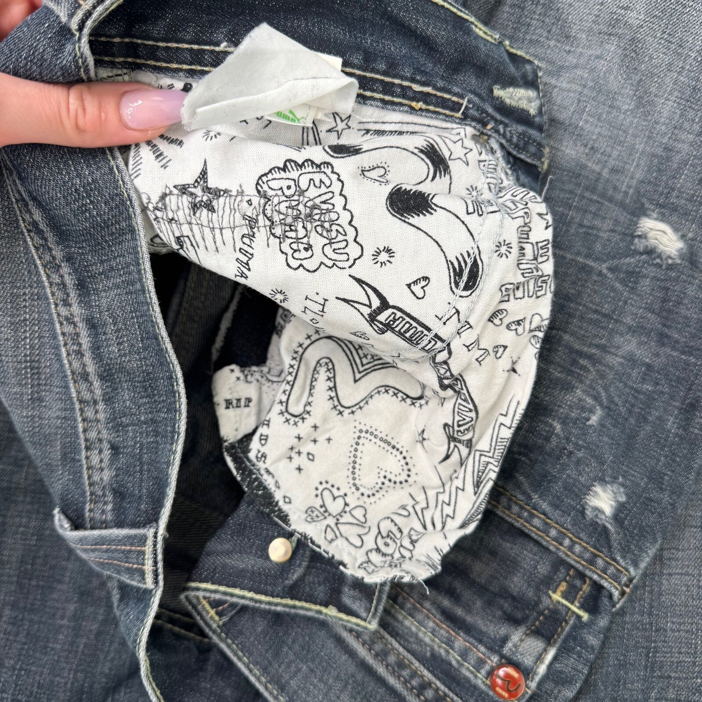 Y2K vintage Evisu x Puma bootcut jeans dark faded denim wash distressed