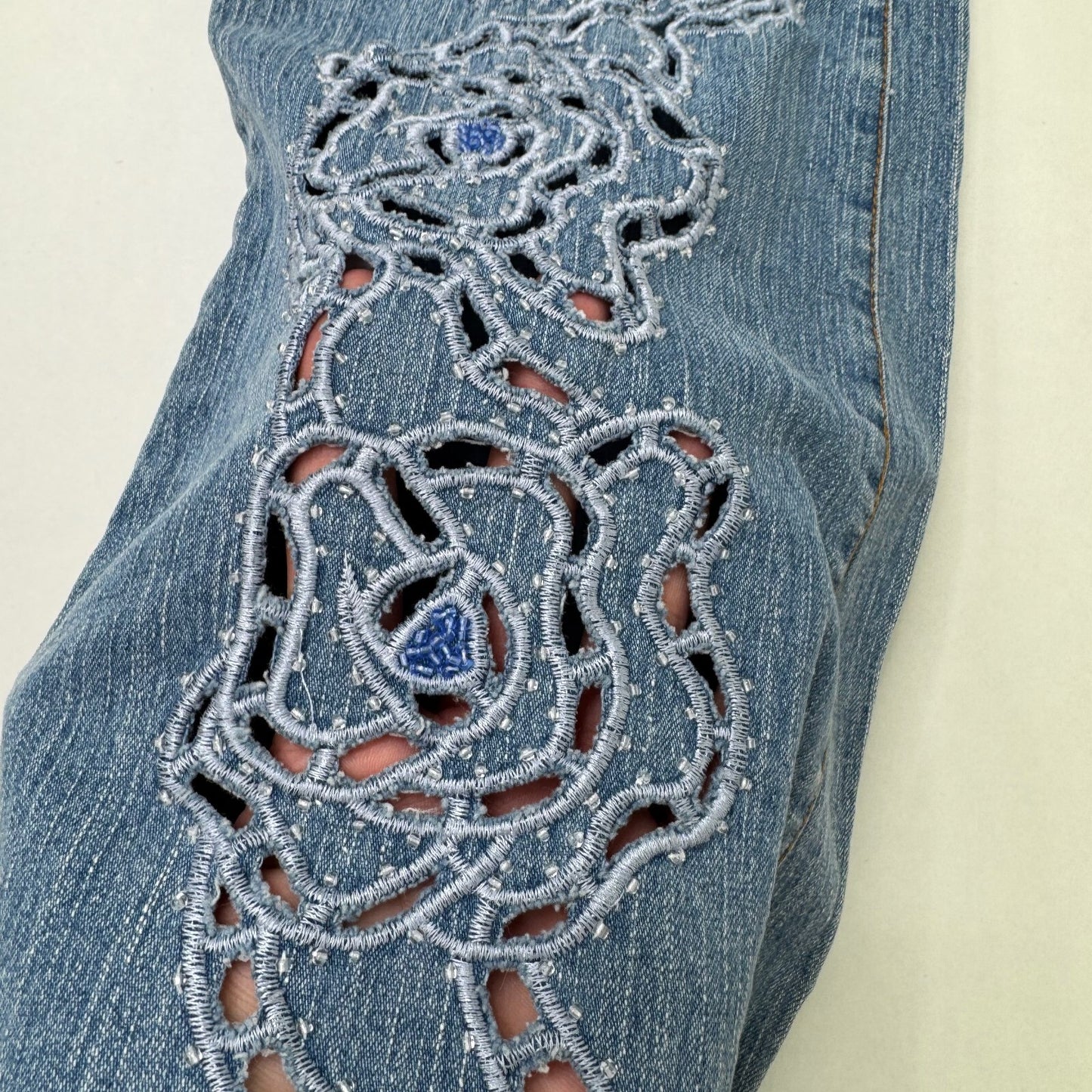 Y2K vintage bootcut denim jeans cut out beaded floral pattern light blue wash