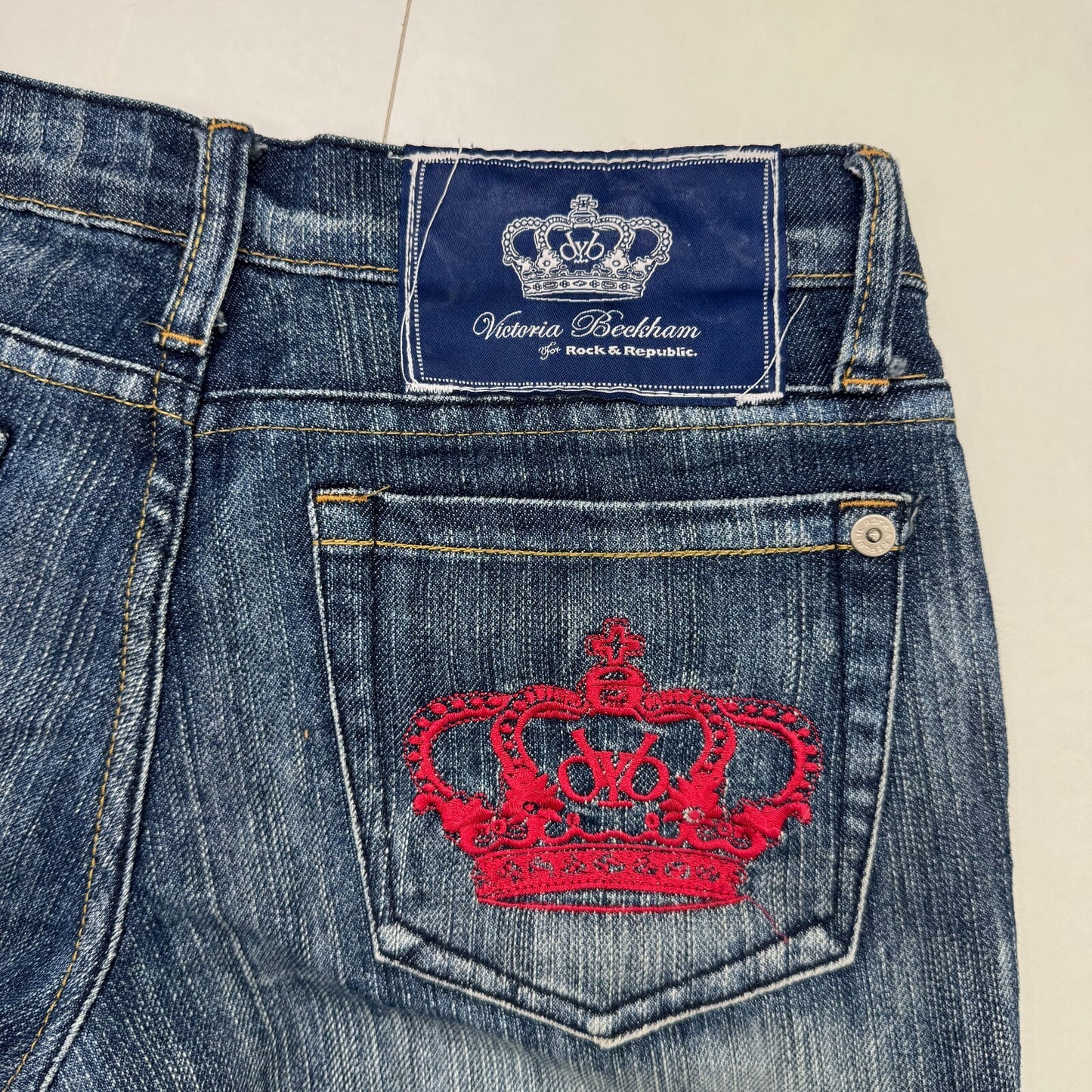Y2K vintage Victoria Beckham bootcut denim jeans red crown faded low rise
