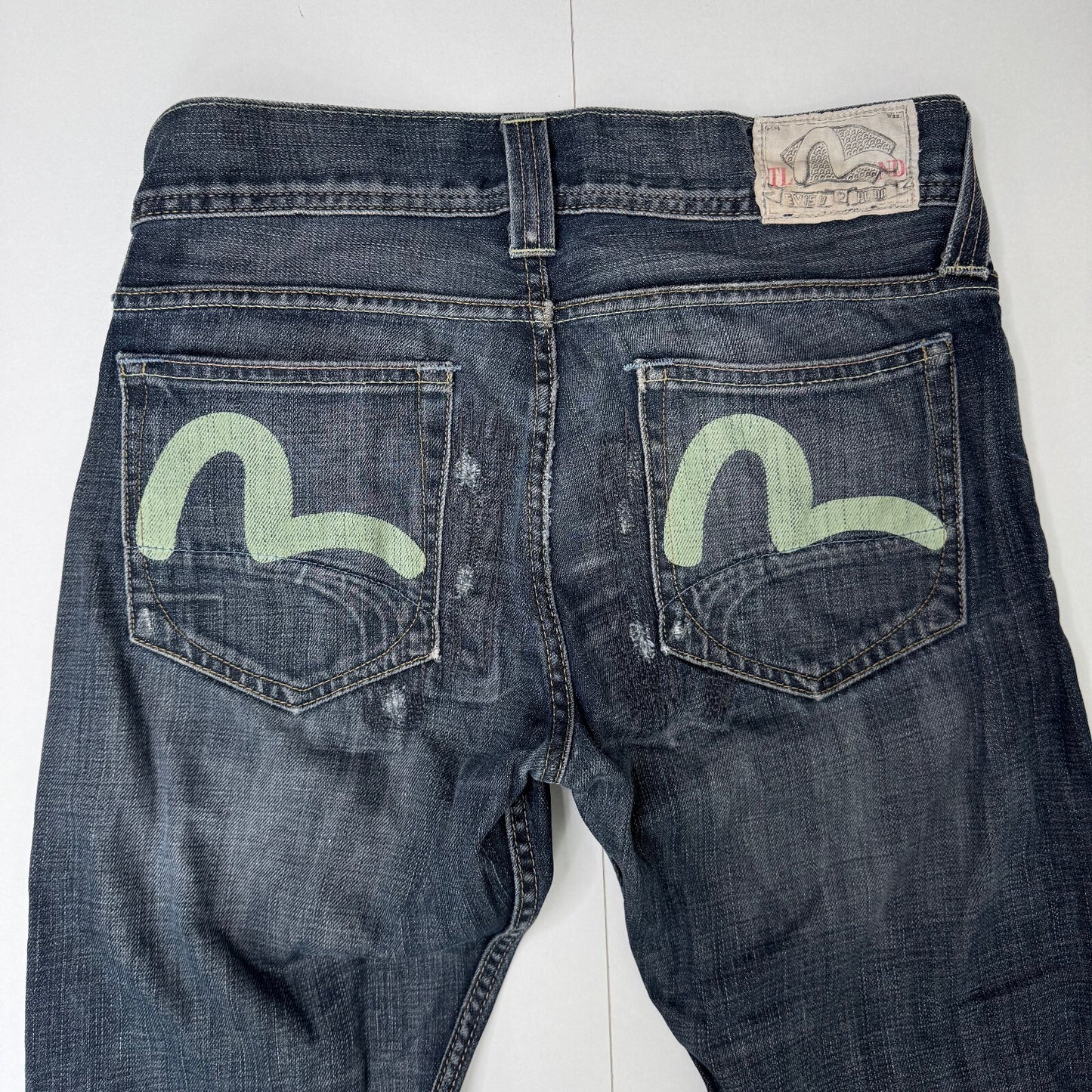 Y2K vintage Evisu x Puma bootcut jeans dark faded denim wash distressed