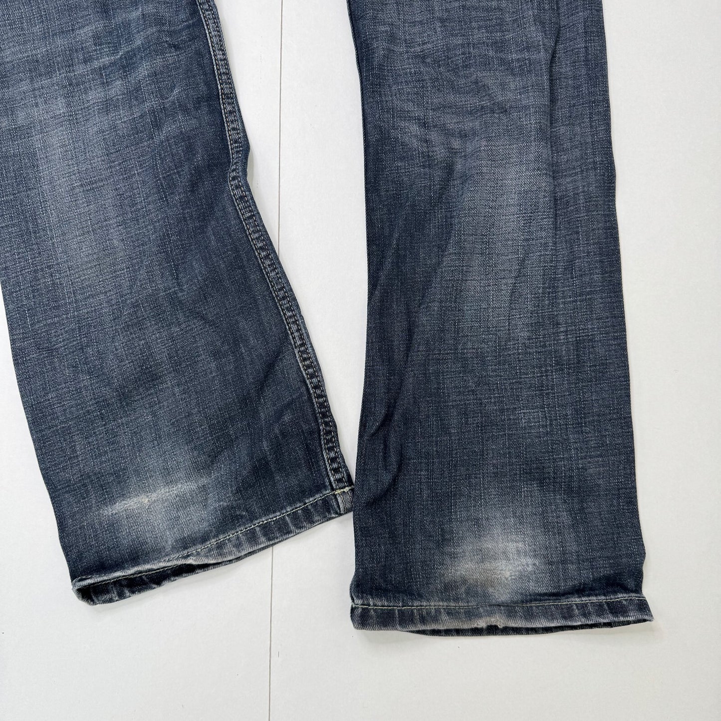 Y2K vintage Evisu x Puma bootcut jeans dark faded denim wash distressed