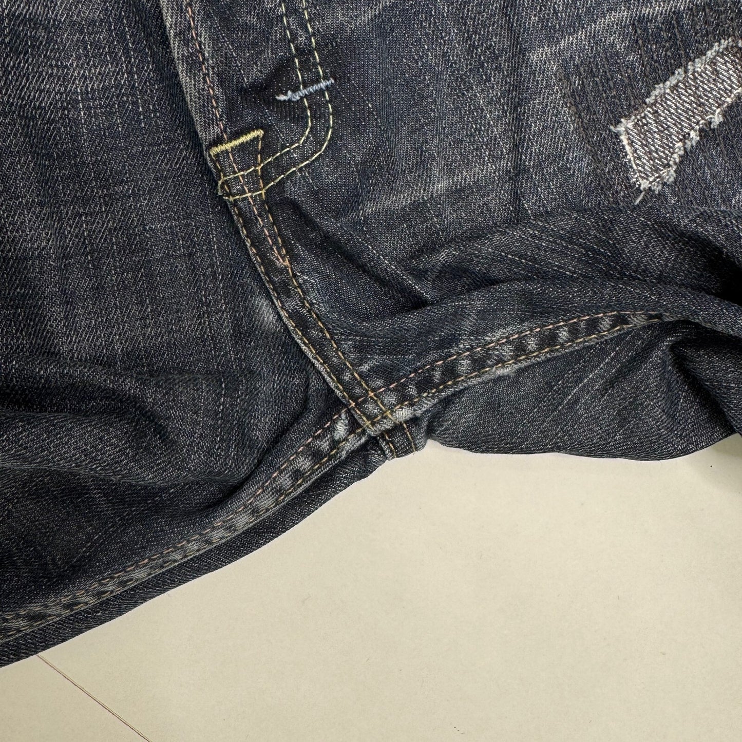 Y2K vintage Evisu x Puma bootcut jeans dark faded denim wash distressed