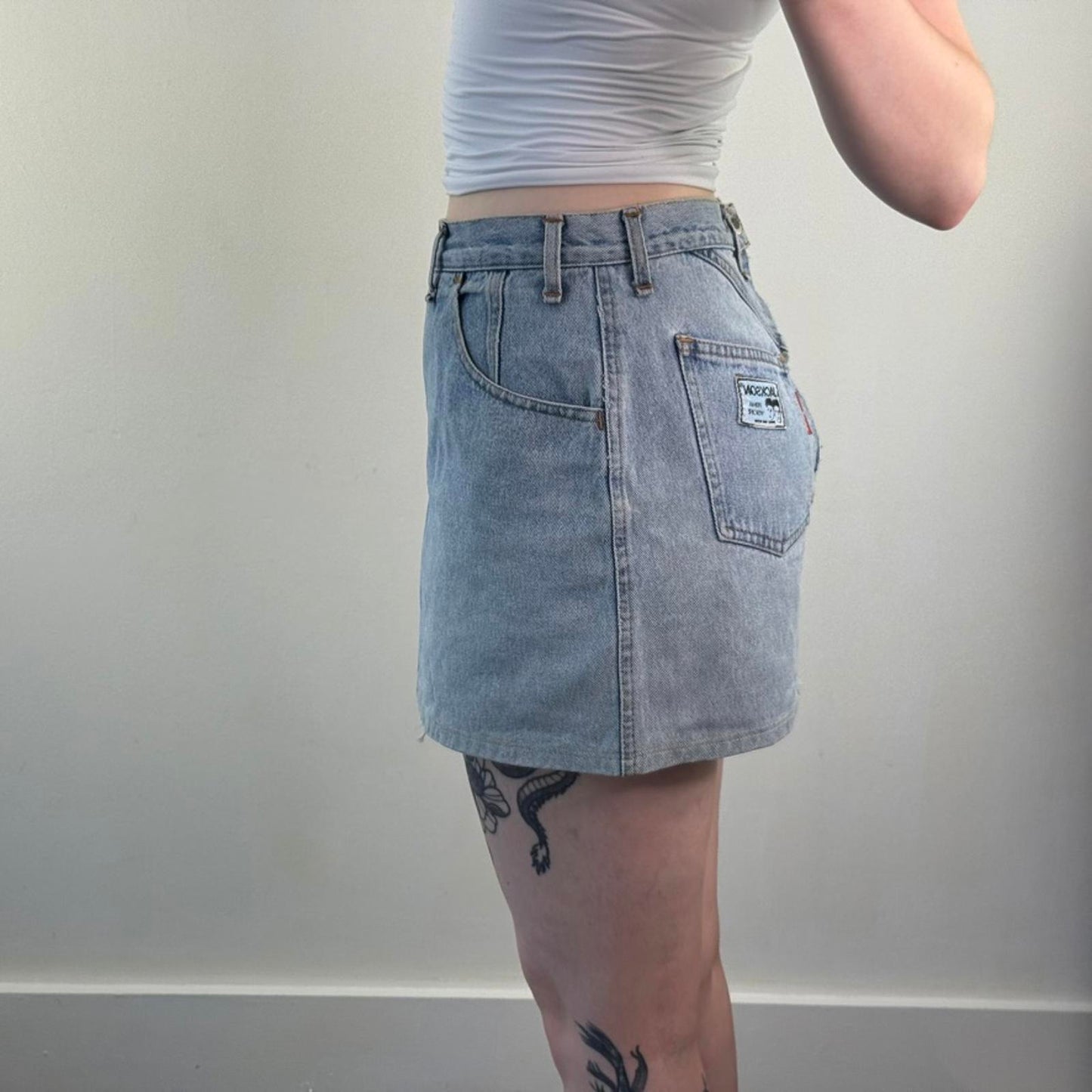 90s Y2K vintage denim mini skirt zipper fraying hem light blue wash mid rise