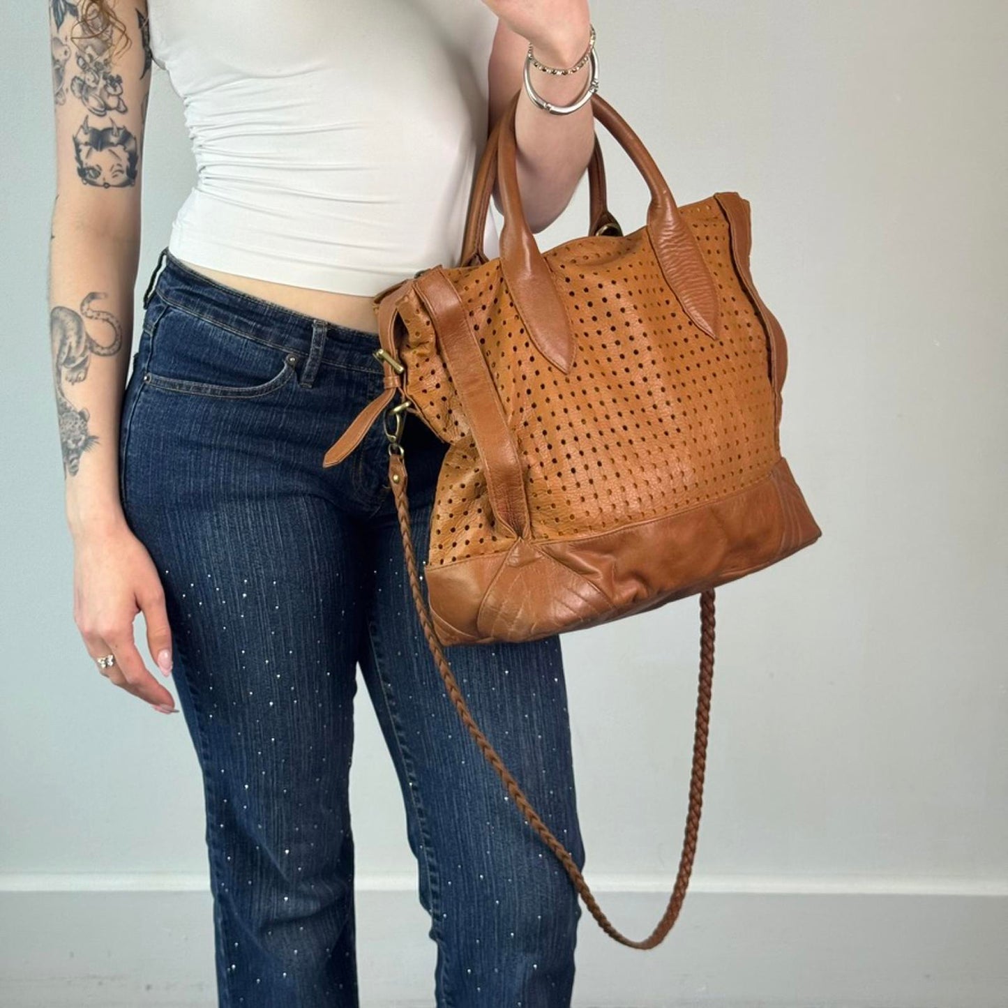 Oversized genuine perforated leather handbag braided strap large buckles boho