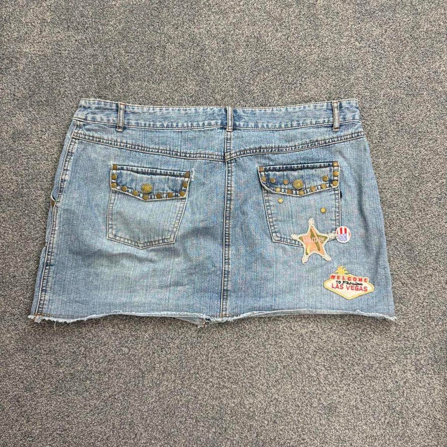 Y2K vintage low rise studded skull denim mini skirt patch usa military mcbling