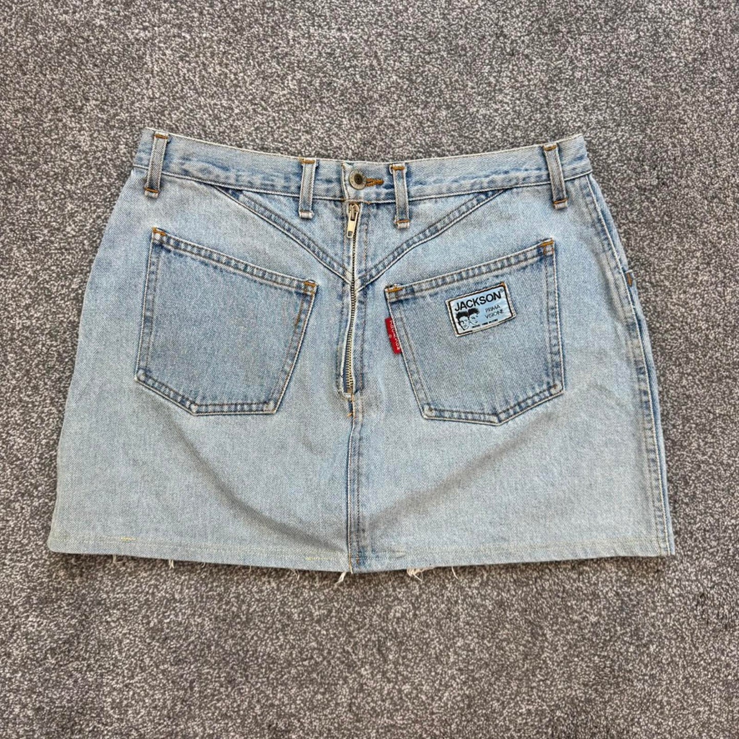 90s Y2K vintage denim mini skirt zipper fraying hem light blue wash mid rise