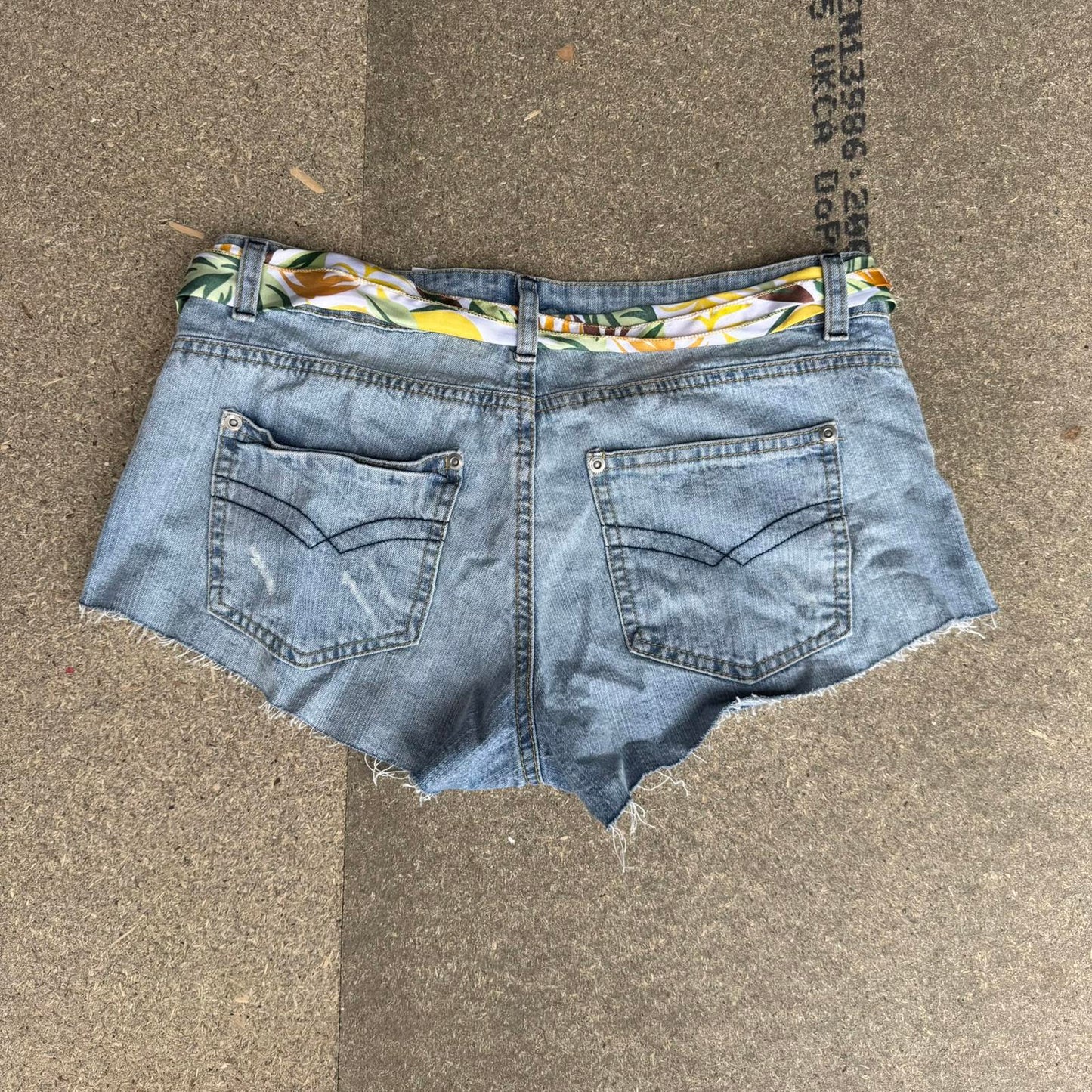 Y2K vintage low rise raw hem mini denim shorts with sunflower bow belt