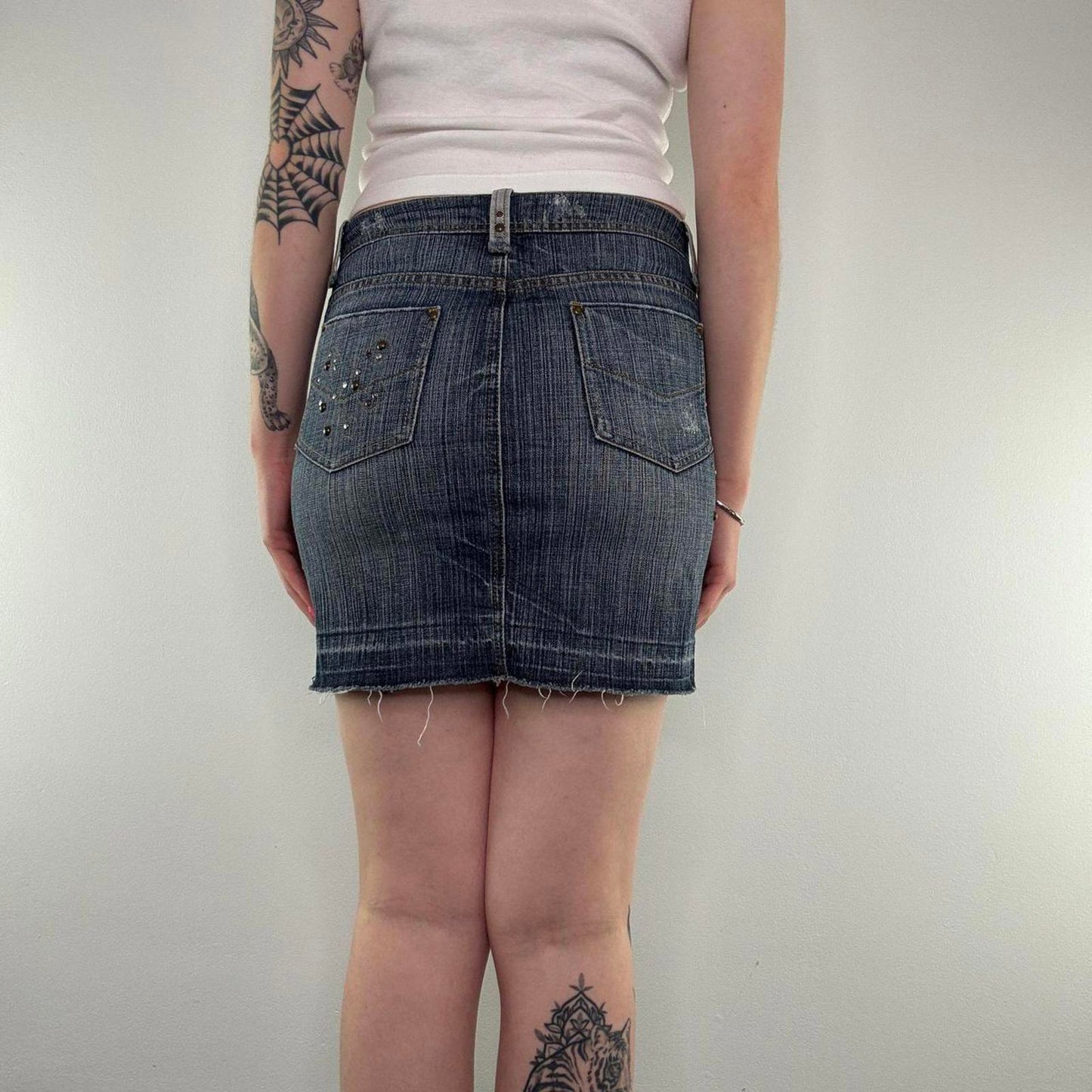 Y2K vintage studded mini skirt faded denim fraying hem embellished dark blue