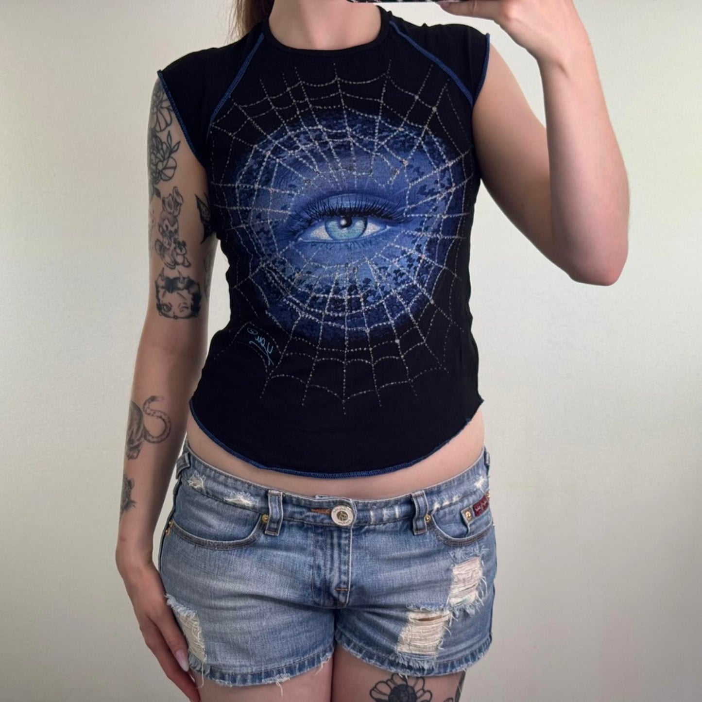 Y2K vintage cap sleeve graphic print t shirt baby tee spiderweb eye curved hem
