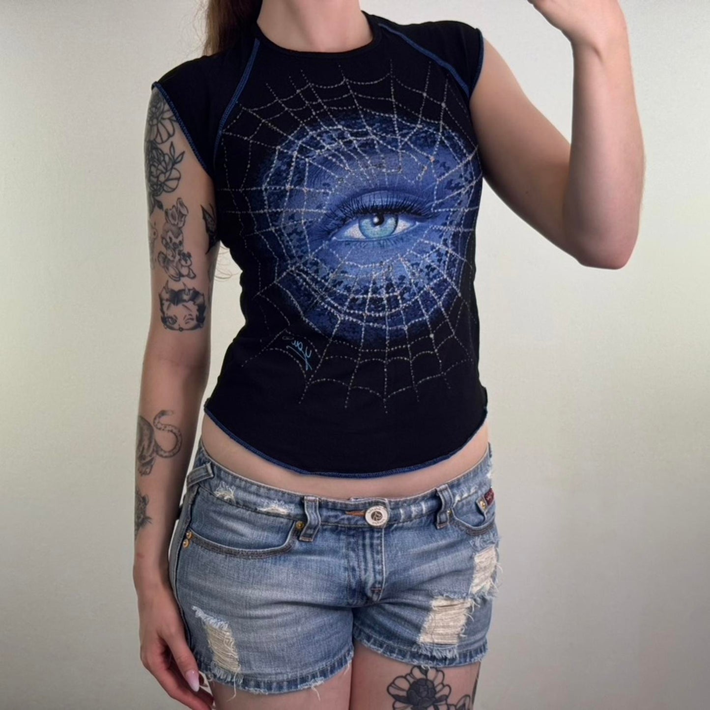 Y2K vintage cap sleeve graphic print t shirt baby tee spiderweb eye curved hem